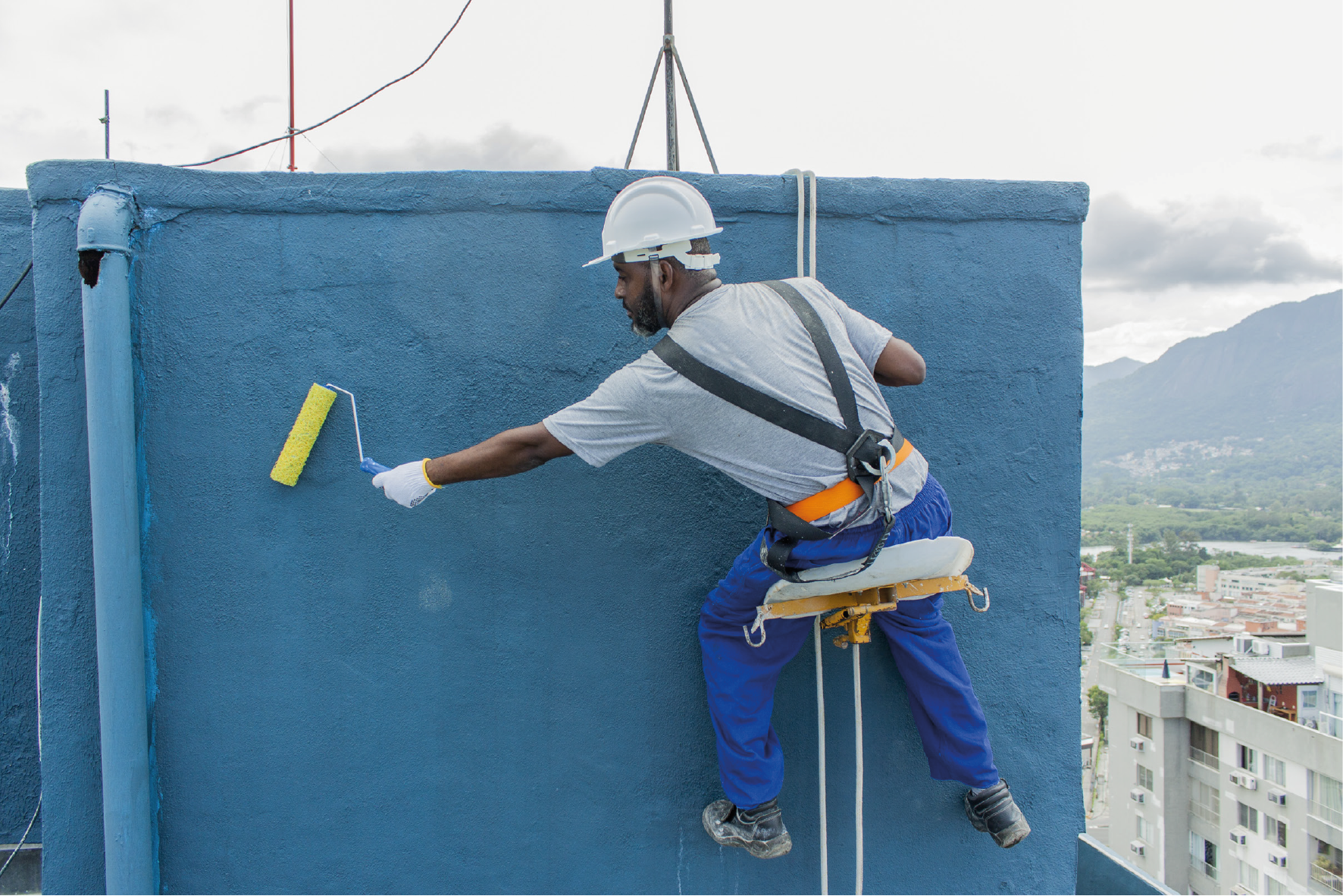 Happy customer admiring freshly painted wall